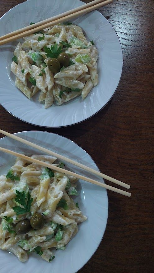 Macaroni in plates with Chinese sticks